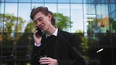 Shot move around businessman stand in the city center street talking phone near modern office smile technology