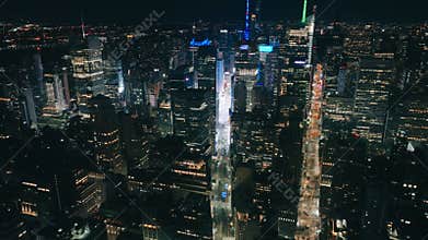 Aerial helicopter overhead top down view of Times Square at night, Establishing