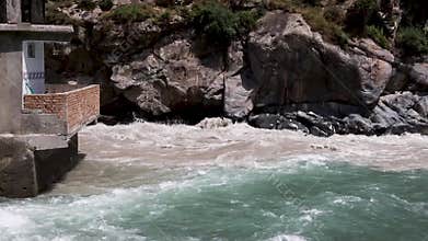 Meeting point of a green water and brown water in the river swat at bahrain valley, Pakistan