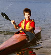 Teenager Rowing a Boat