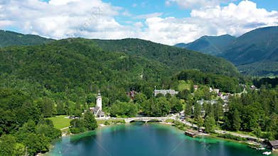 Aerial view of Bohinj lake in Julian Alps. Popular touristic destination in Slovenia. Bohinj Lake, Church of St John the Baptist.
