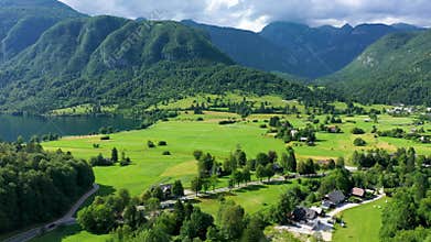 Aerial view of Bohinj lake in Julian Alps. Popular touristic destination in Slovenia. Bohinj Lake, Church of St John the Baptist.