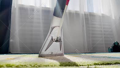 : Fresh and clean woven floor carpet after thorough spring deep cleaning. Revealing clean fabric at washing and