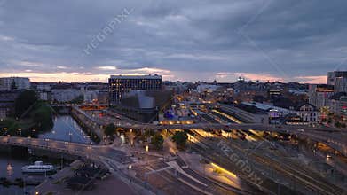Modern transport infrastructure in evening city. Road bridge over railway tracks nearby Central train station. Stockholm