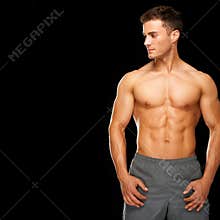 Sporty and healthy muscular man isolated on black