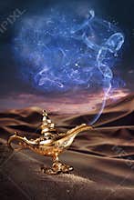 Magic Aladdin's Genie lamp on a desert