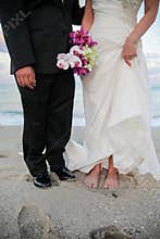 Bride and groom on beach