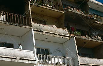 An apartment building show war damage in Angola