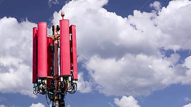 Antenna for mobile phones in front of moving clouds