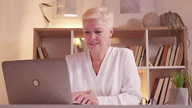 business coach web conference senior woman laptop