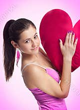 Smiling pretty woman in pink dress