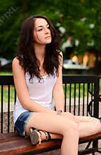 Girl sitting on a bench