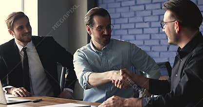 Group of businessmen making deal shake hands finish meeting