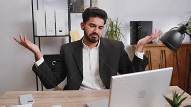 Confused businessman embarrassed about ambiguous question, having doubts, no answer idea, clueless