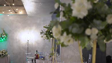 Served tables for a holiday in a restaurant. Glasses, plates, cutlery, napkins.