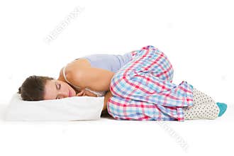 Young woman in pajamas sleeping on pillow