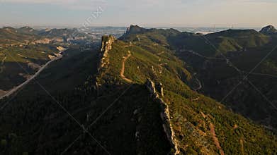 aerial scenic landscape with green fields, meadows, curved mountain river and mountain ridge with high mountains and