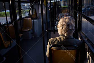 Old woman in bus