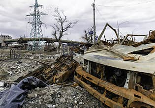 burnt cars and destroyed buildings of the workshop of the Azovstal plant in Mariupol