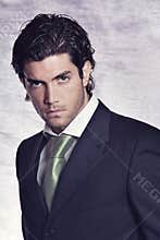 Elegant and stylish male model in black dress