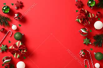 Christmas ornaments and gift boxes frame borders. Xmas decoration on red background. Happy New Year greeting card template. Top