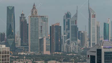 Rows of skyscrapers in financial district of Dubai aerial night to day timelapse.