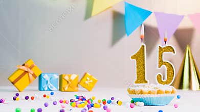 Happy birthday card from candles with the number 15, golden numbers from candles for congratulations on any holiday with beautiful