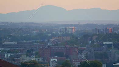 Sherbrooke city panoramic panning motion view of Quebec Eastern Township Estrie mountain and buildings
