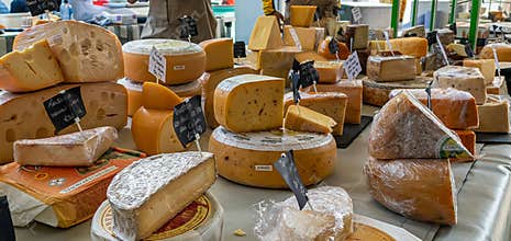 Variety of cheeses at the Milk Market, traditional farmers market in Limerick, Ireland