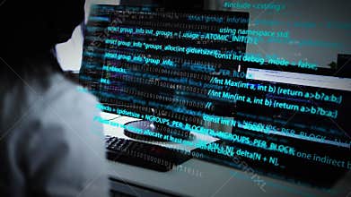 Computer programmers type and write code on the keyboard