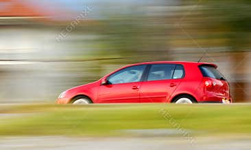Fast moving red car