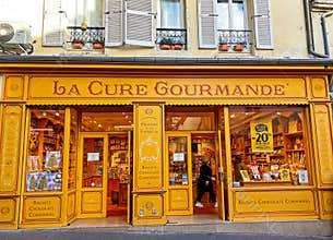 Closeup of old traditional yellow vintage La cure gourmande confectionary biscuits chocolate store