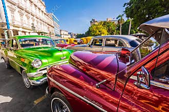 Shiny classic vintage cars parked in Old Havana