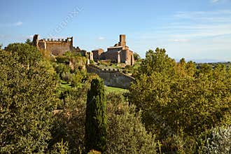 Tuscania, Viterbo, Lazio, Italy: landscape of the countryside with the ruins of the ancient city walls and the medieval Saint