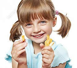 Happy little girl eating a french fries