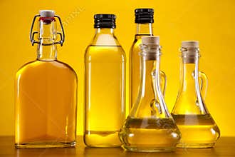 Olive oils on yellow background