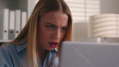 Close up angry upset Caucasian woman user using laptop in home office frustrated mad confused shocked computer problem