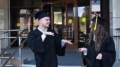 Hard of hearing graduates communicate in sign language.