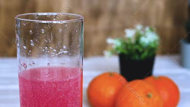 Close-up Vitamin pop with water. The concept of drinking vitamin c in tablets. Fruit juice or freshly squeezed. Medicinal