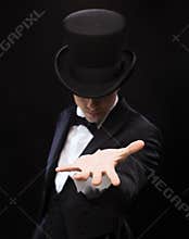 Magician holding something on palm of his hand