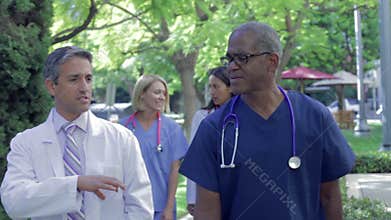 Medical Team Having Discussion Outdoors