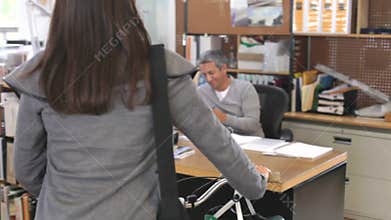 Architect Arrives At Office And Wheels Bike Past Colleagues