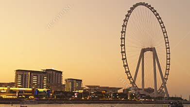 UAE, Dubai, 21 November 2024: The famous largest observation wheel The Eye of Dubai at sunset - Ain Dubai, island