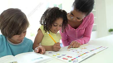 Mother Helping Children With Homework