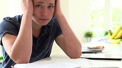 Slow Motion Sequence Of Depressed Boy Studying At Home