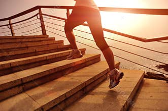 Healthy lifestyle woman legs running on stone stairs