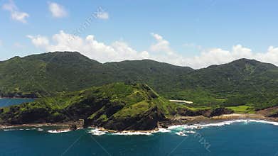 A tropical island and the sea.