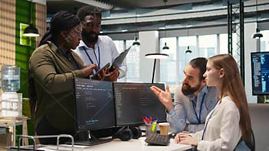 Teamworking programmers developing software applications, working together