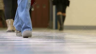 Teen high school students walking in hallway
