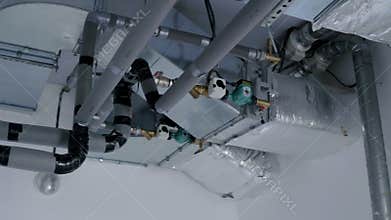 Ventilation system with ductwork and pipes, showcasing intricate design and functionality, highlighting air circulation